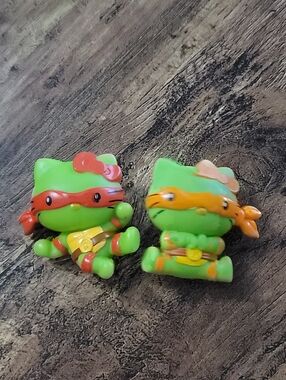 2 McDonald's TMNT Hello Kitty Figures